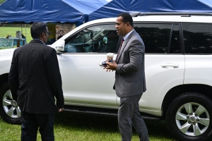 Principal greets Minister of Education in an event hosted by the school together with the MOE.